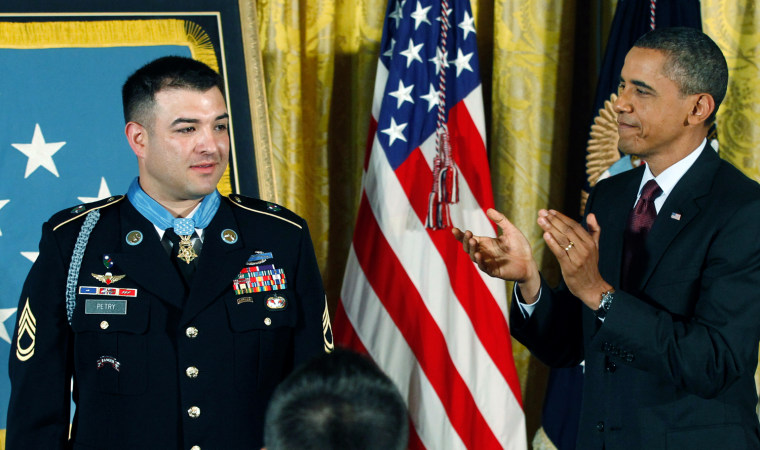 Image: Obama applauds Sergeant First Class Leroy Arthur Petry after awarding him with the Medal of Honor at the White House in Washington